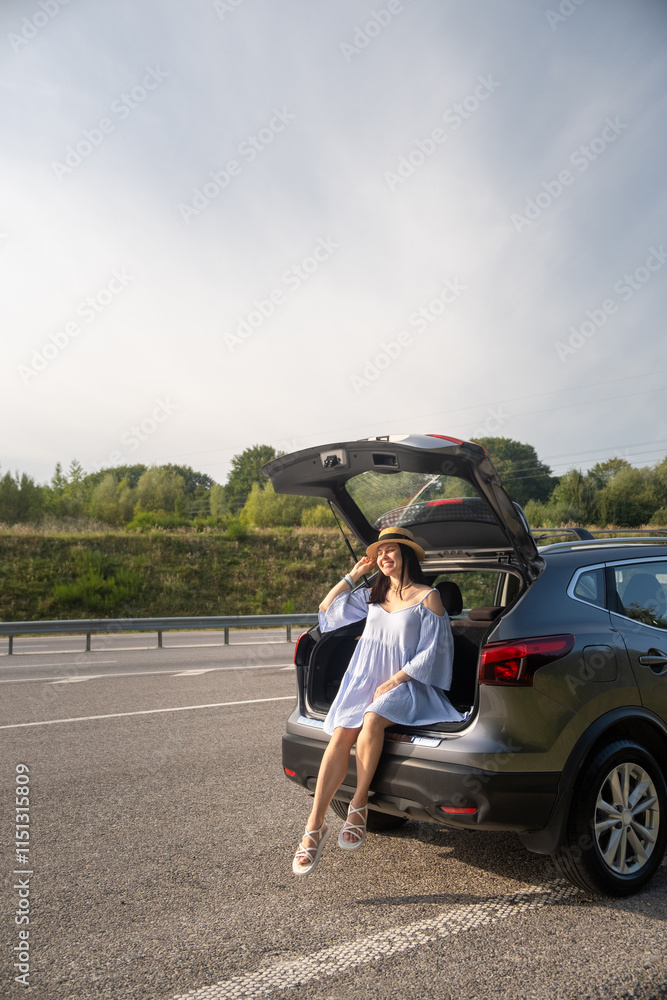 Woman Enjoying a Sunny Day by Her Car