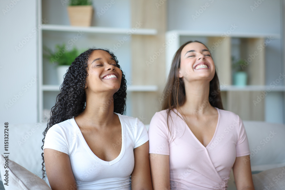 Happy interracial couple breathing together relaxing at home Happy interracial couple breathing together relaxing at home