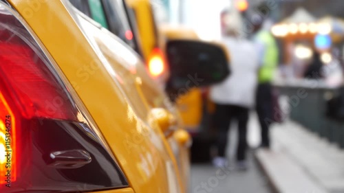 New York City Grand Central Terminal railway station, 42 street. Manhattan Midtown. Yellow taxi cab row, car transport on Pershing Square, NYC, USA. American urban road traffic, people pedestrians.