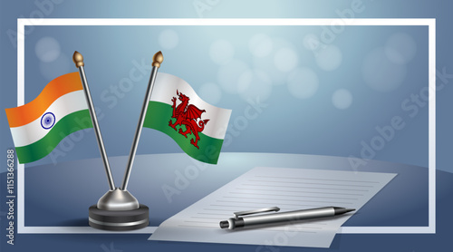 India and Wales National flags on small table with bokeh background, cooperative relationship