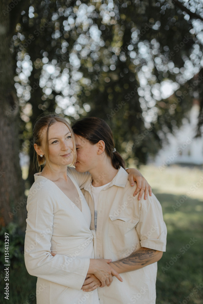 Cheerful couple embracing at park