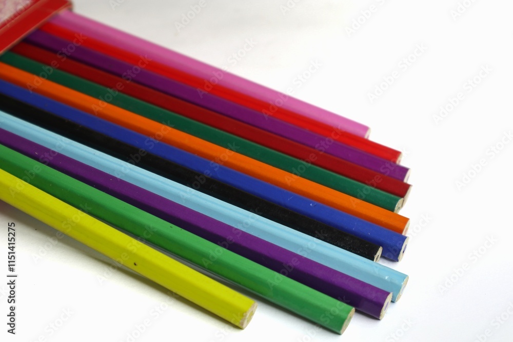 A box of colored pencils is shown against a white background. A box of colored pencils is shown against a white background.