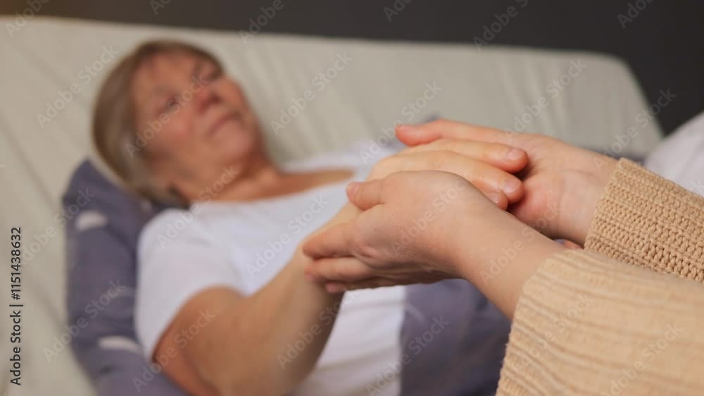 A gentle interaction occurs as a caregiver holds the hand of a patient, providing emotional support in a serene setting. The focus is on healing and compassion during this moment A gentle interaction occurs as a caregiver holds the hand of a patient, providing emotional support in a serene setting. The focus is on healing and compassion during this moment