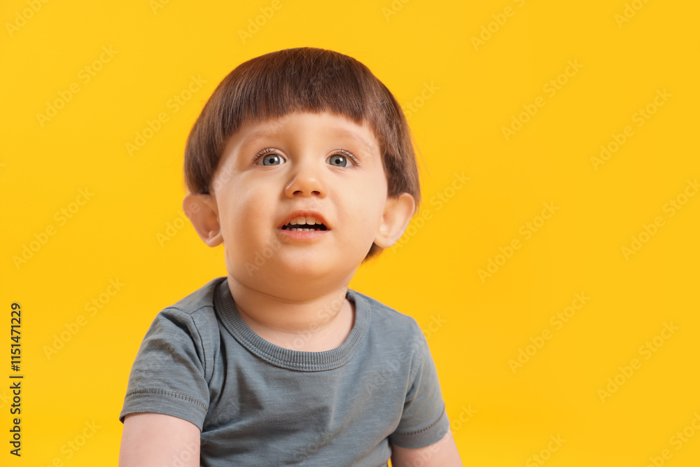 Portrait of cute little boy on yellow background. Space for text Portrait of cute little boy on yellow background. Space for text
