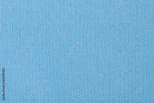 Light blue fabric as a background macro photo.