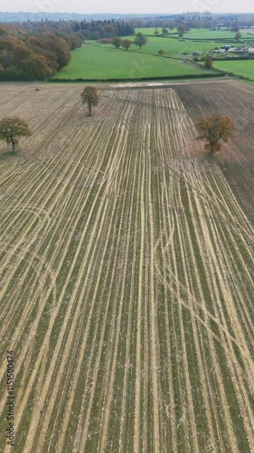 Vertical aerial footage of the agricultural fields in the countryside of Tonbridge town, England, UK photo