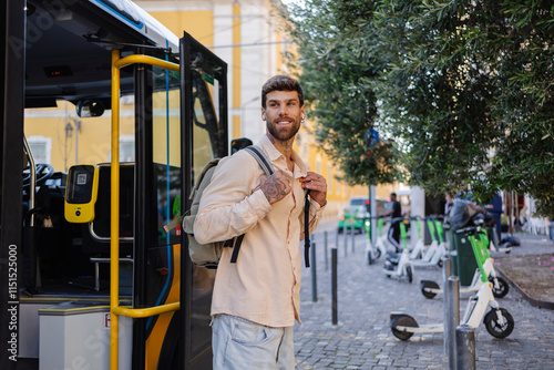 Photos Young tourist getting off the bus in lisbon, portugal, with electric scooters pa