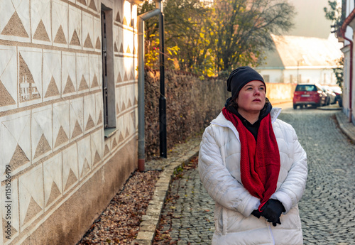 Obraz na płótnie A plus-size woman strolling through the streets of a small European town. w salonie