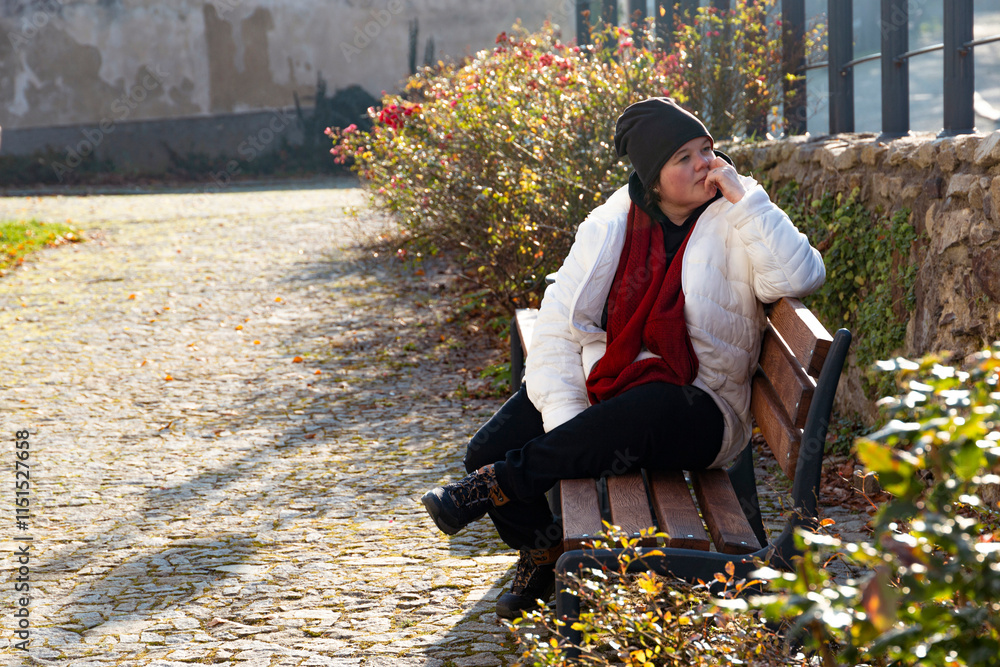 A plus-size woman strolling through the streets of a small European town.