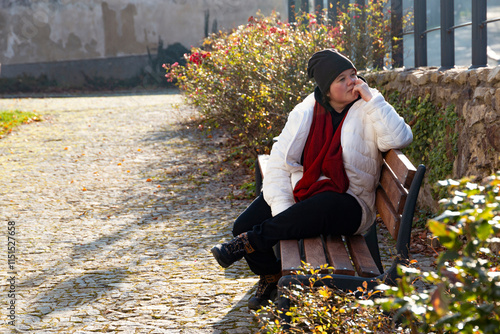 Obraz na płótnie A plus-size woman strolling through the streets of a small European town. w salonie