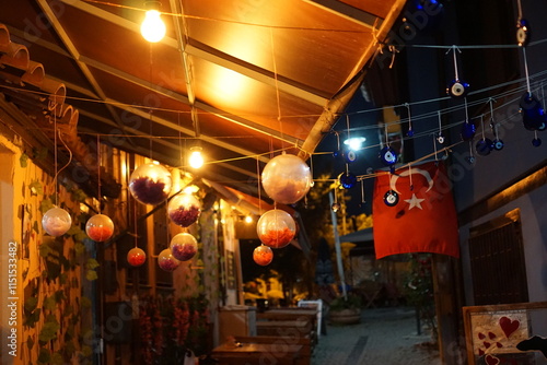 city lights and ornaments at night with turkish flag