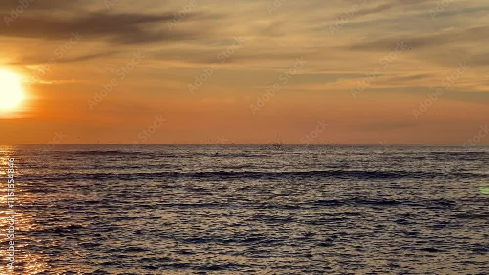 clip of the sun on water with waves, sea, ocean, river, lake or lagoon with wind and the reflection of the sunset colors. clip of the sun on water with waves, sea, ocean, river, lake or lagoon with wind and the reflection of the sunset colors.