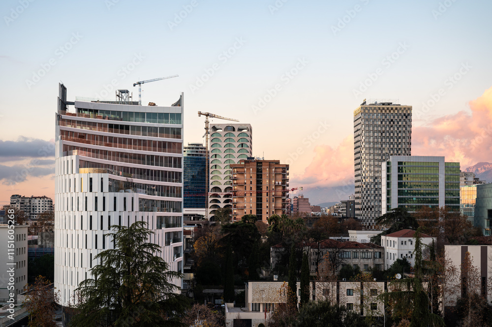 High angle view over colorful apartment blocks and mountains at dusk in the city of Tirana, Albania High angle view over colorful apartment blocks and mountains at dusk in the city of Tirana, Albania