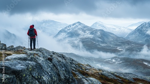 A person with a backpack hiking in a mountain landscape.