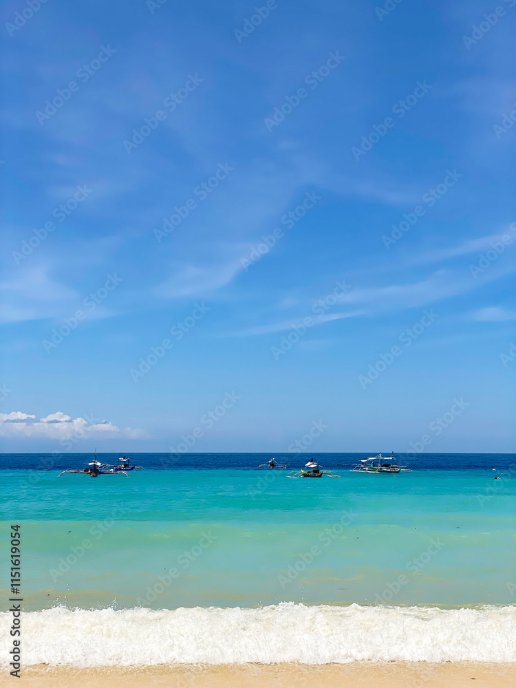 Fishing boats over the sea surface. Ocean waves on beach resort. Samal Island. Davao, Philippines. Fishing boats over the sea surface. Ocean waves on beach resort. Samal Island. Davao, Philippines.