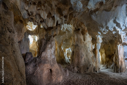 Interior of the large hall of old Karain cave, hidden in Mediterranean region. Confirms human habitation since the early Paleolithic age between 150,000 and 200,000 years ago.Yagca, Antalya, Turkey. photo