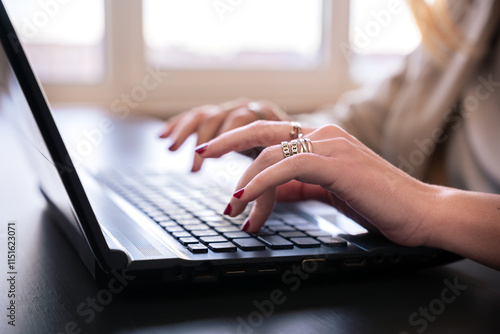 Close-Up of Female Hands Typing on Laptop