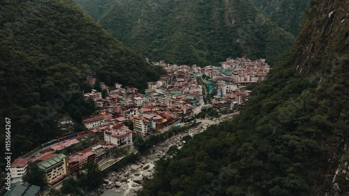 Machupicchu Pueblo Village By Urubamba River In Peru. - aerial shot photo