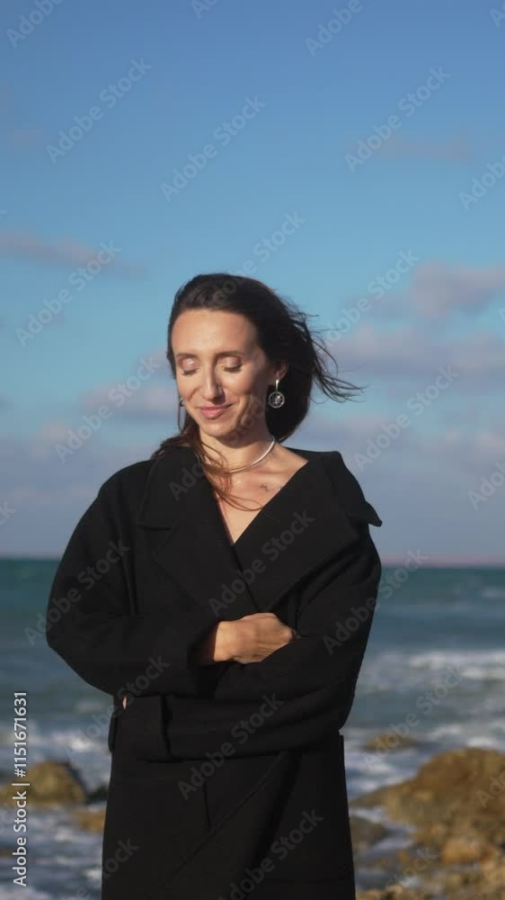 Woman Beach Seascape Portrait Woman Beach Ocean Waves - A woman sits on a rock on a beach as ocean waves crash against the shore. Woman Beach Seascape Portrait Woman Beach Ocean Waves - A woman sits on a rock on a beach as ocean waves crash against the shore.