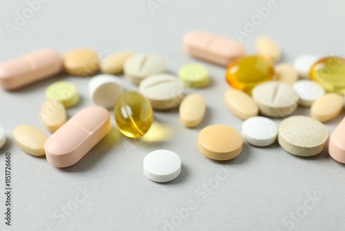 Various pills on a gray background