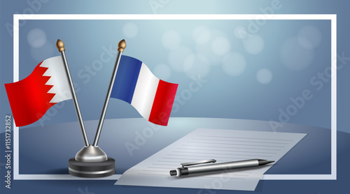 Bahrain and France National flags on small table with bokeh background, cooperative relationship