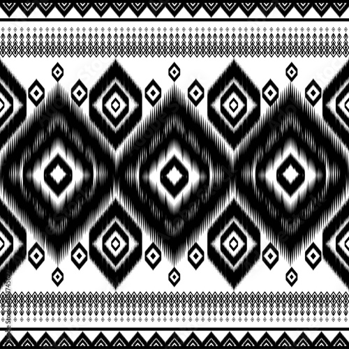 design vector illustration seamless black white ikat ornamental pattern. features chevron motif subtle scribble-textured effect, giving idynamic handcrafted pattern reflects ethnic aesthetic, inspired photo