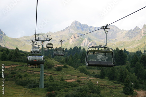 cable car in the mountains with the Alps as a background