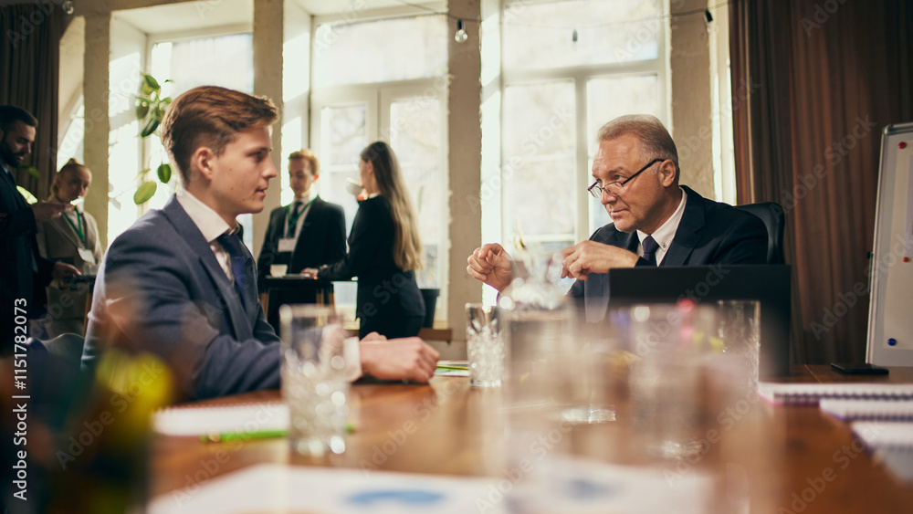 Senior businessman and young employee discuss career strategies and long-term goals, leader offering advice to young worker. Concept of business, professional development, support, mentorship Senior businessman and young employee discuss career strategies and long-term goals, leader offering advice to young worker. Concept of business, professional development, support, mentorship