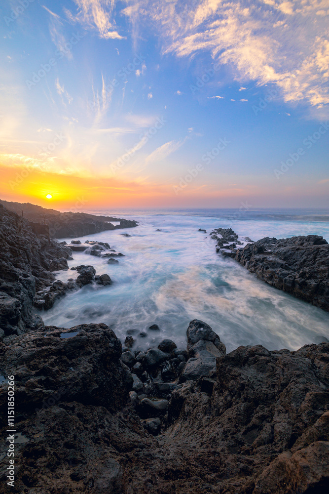 The sea breaking against the rocks The sea breaking against the rocks