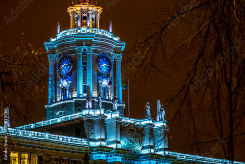 Photography The clock on the town hall at night in the city
