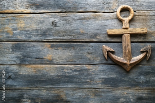 Nautical anchor design on weathered wooden background in coastal style décor photo