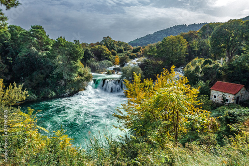 Obraz na płótnie Krka National Park, Šibenik-Knin – HR - Oct 17, 2024 Skradinski buk waterfall, with cascading tiers, lush greenery, and crystal-clear turquoise waters. w salonie