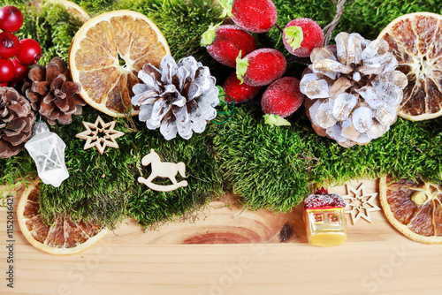 Classic Christmas garland with moss and dried fruits.