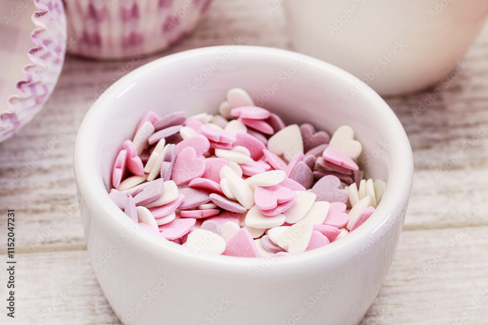 Bowl of pink sprinkles to decorate biscuits and cupcakes.