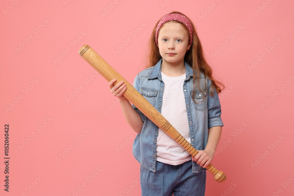 Little girl with baseball bat on pink background Little girl with baseball bat on pink background