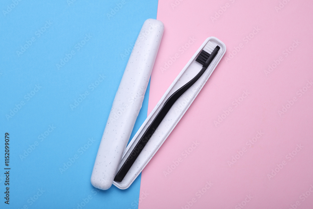 Plastic toothbrush with case on blue pink background Plastic toothbrush with case on blue pink background