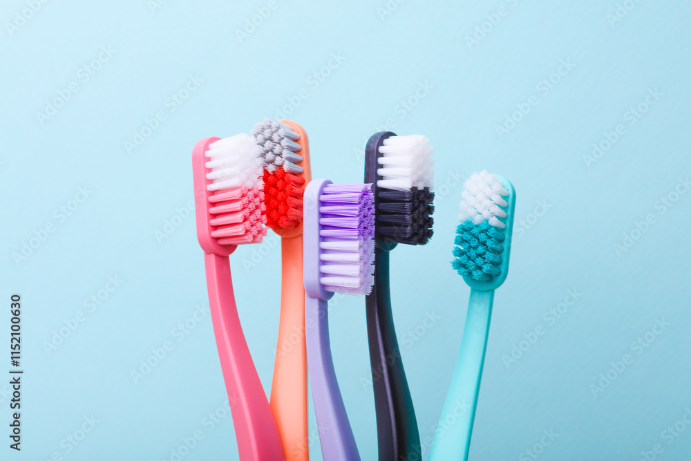 Many Plastic toothbrushes on blue background Many Plastic toothbrushes on blue background