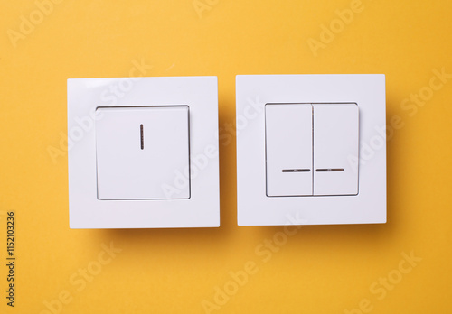 Light Switches on yellow Background. Top view photo