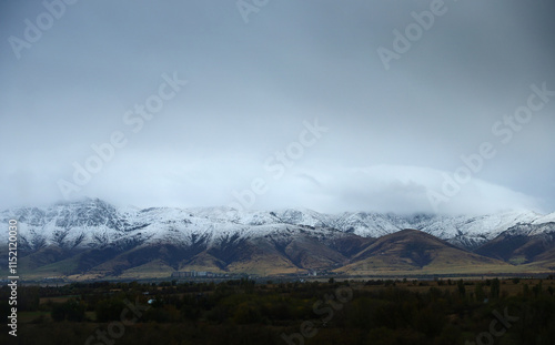 Mountain valley and dark overcast sky in Kazakhstan photo