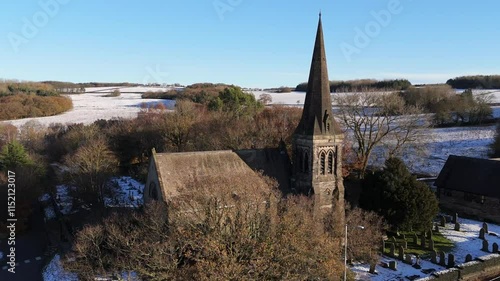 Drone footage of the Christ Church Douglas-in-Parbold on a sunny day winter day in Parbold, England photo