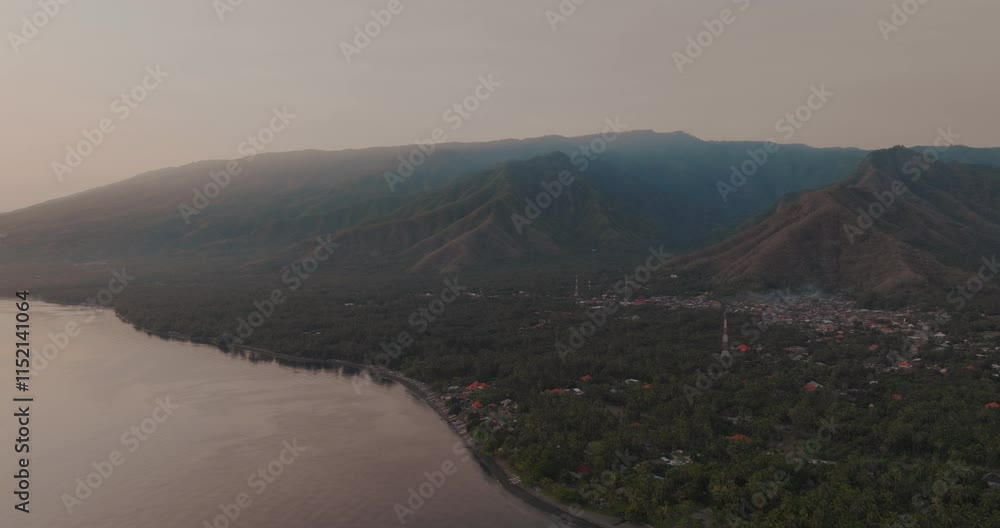 orbiting drone shot of the mountains along the coastline of northern Bali, Indonesia