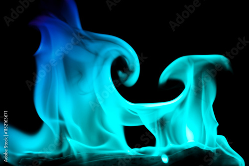 A vibrant display of swirling blue fire against a dark backdrop. photo