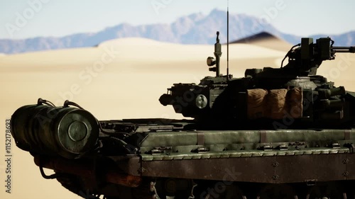 A military tank stationed in the desert sands, showcasing its rugged appearance against the arid landscape. photo