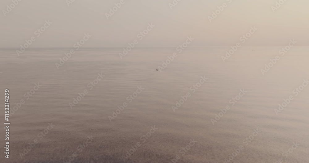 drone shot of a lone fishing boat in the middle of the ocean near bali drone shot of a lone fishing boat in the middle of the ocean near bali