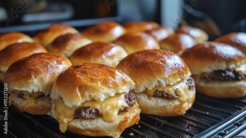 Delicious cheeseburger sliders with Hawaiian rolls just out of the oven ready to enjoy