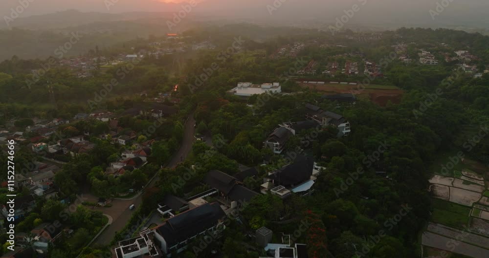 Aerial drone shot of the sun rising over the mountains in Bogor, Indonesia Aerial drone shot of the sun rising over the mountains in Bogor, Indonesia