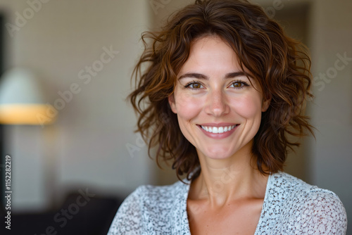 Free Download A woman with curly hair smiling at the camera - GFXLoad