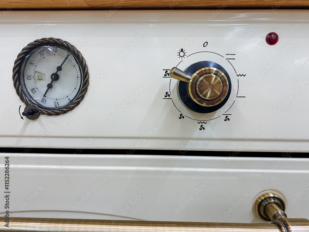 A classic white stove featuring a gauge for monitoring and a knob for controlling the temperature, making it a functional and essential home appliance for cooking and baking A classic white stove featuring a gauge for monitoring and a knob for controlling the temperature, making it a functional and essential home appliance for cooking and baking