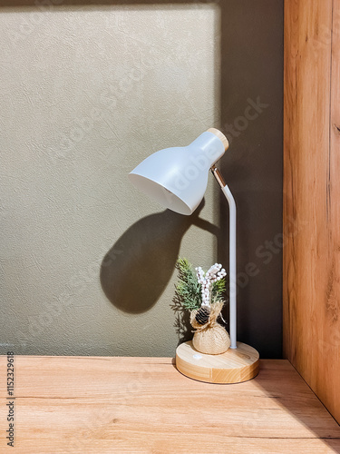 This contemporary modern desk lamp is beautifully complemented by decorative plants in a stylish minimalist home office setting, creating a vibrant and inspiring workspace photo