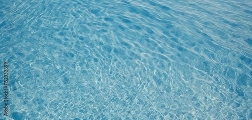 a tranquil, minimalistic composition of clear blue water with gentle ripples